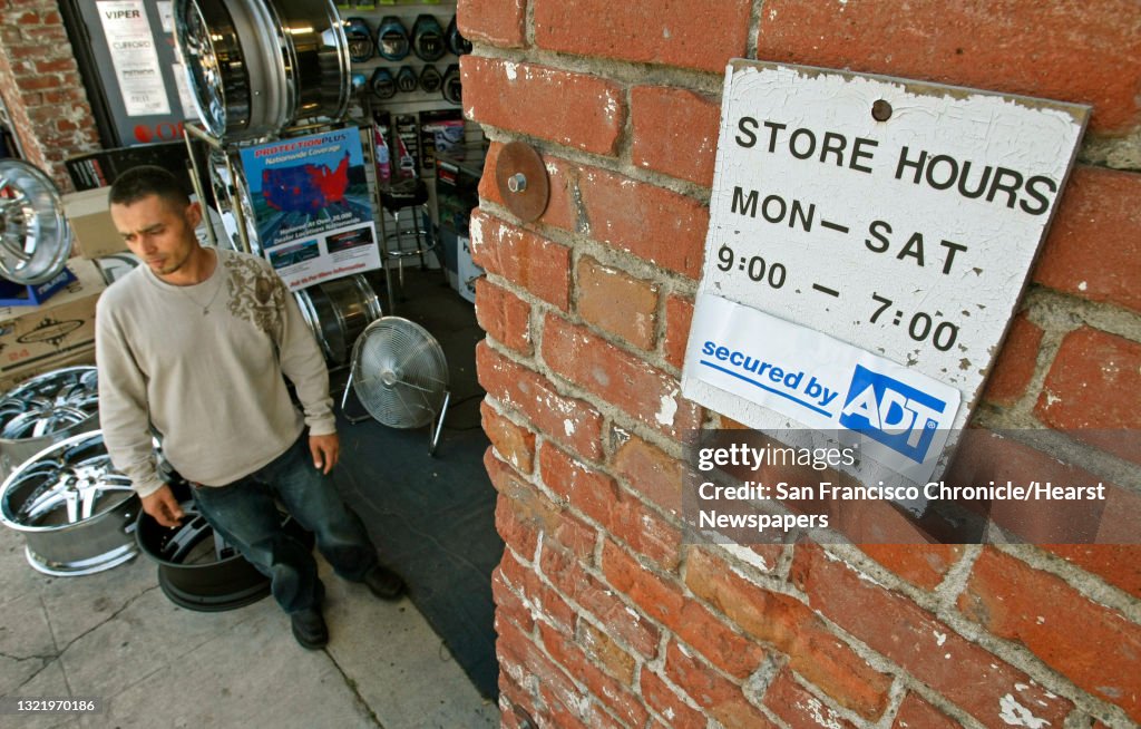 Junior Moosayar, owner of Junior's Car Stereo in Fremont, Calif., on May 21, 2008, in his shop surrounded by car accessories. He hired a private security company as well as installed several video cameras after the City of Fremont stopped responding to b