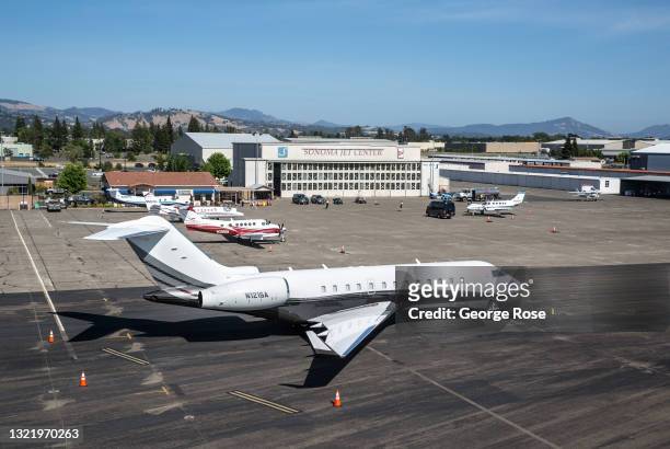 Corporate passenger jet is temporarily parked at Sonoma Jet Center at Charles M. Schulz Sonoma County Airport in this aerial photo taken on June 1 in...