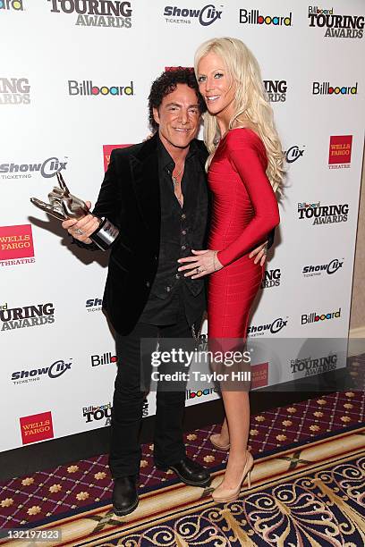 Neal Schon of Journey and Michaele Salahi attend the 2011 Billboard Touring Awards at the Roosevelt Hotel on November 10, 2011 in New York City.