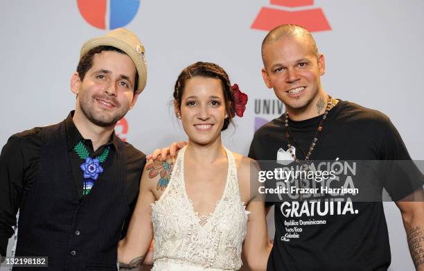 Musicians Eduardo Cabra Martinez , Ileana Cabra Joglar, and Rene Perez Joglar of the band Calle 13 pose in the press room during the 12th Annual...