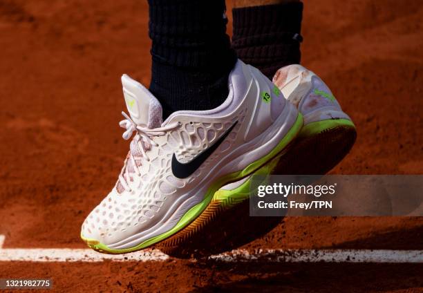 Rafael Nadal of Spain against Cameron Norrie of Great Britain wearing tennis shoes with the number 13 on the side in the third round of the men's...