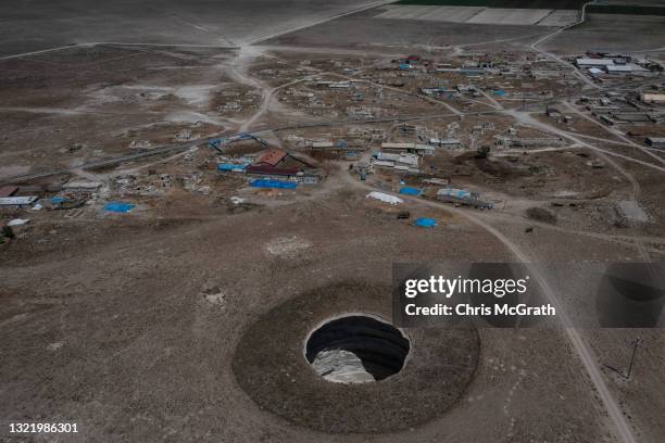 In an aerial view, a massive sinkhole is seen on the outskirts of a village on June 03 in Karapinar, Turkey. In Turkey’s Konya province, the heart of...