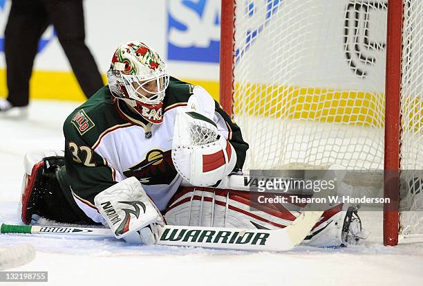 Goaltender Niklas Backstrom of the Minnesota Wild watches the puck go into the net off the stick of Patrick Marleau of the San Jose Sharks in the...