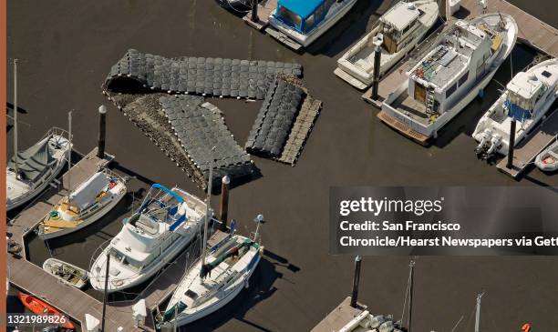 Debris floats on top of the water at the Santa Cruz Harbor in Santa Cruz, Ca., on Friday March 2011, following the aftermath of the hugh Japan...