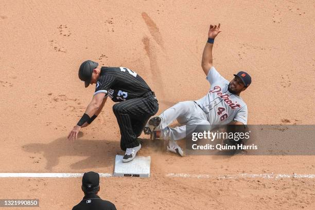 Jeimer Candelario of the Detroit Tigers gets the force out at third base in the sixth inning against Jake Lamb of the Chicago White Sox at Guaranteed...