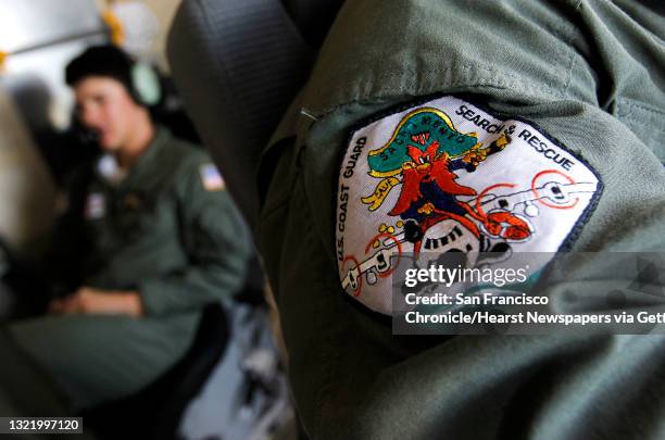 The crew's logo, from the flight deck, as the crew of a C-130 aircraft from Coast Guard Air Station Sacramento, Ca., searches the waters neart Isla...