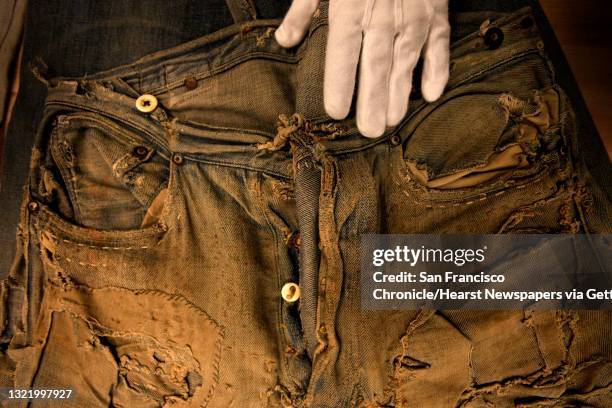 Levi's historian, Lynn Downey displays pair of 501 Levi jeans known as the "Homer Campbell" jeans at their company headquarters in San Francisco, Ca....