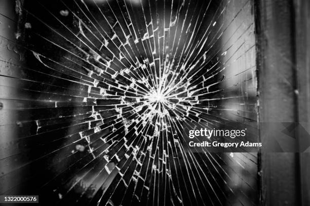 broken glass in a window after a protest - riot stock pictures, royalty-free photos & images