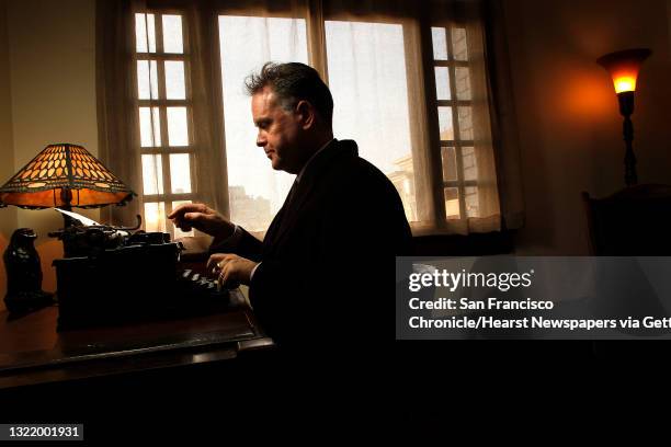 Eddie Muller at the typewriter and desk, inside Dashiell Hammett's old apartment on Friday December 23 in San Francisco, Ca., which is now leased by...