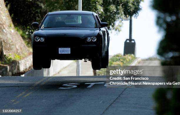 The Dodge Charger goes airborn down Taylor street, as the chase scene is filmed along Taylor Street in San Francisco, Ca. On Thursday March 8, 2012....