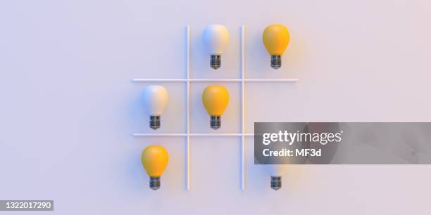 tic-tac-toe with light bulb 3d concept - tic tac toe stock pictures, royalty-free photos & images