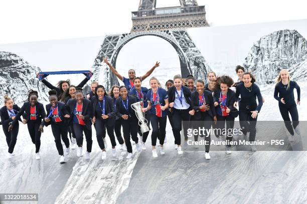 Paris Saint-Germain Women players run with the trophy in front of the Eiffel Tower during the Celebration of the title of French champion D1 Arkema...