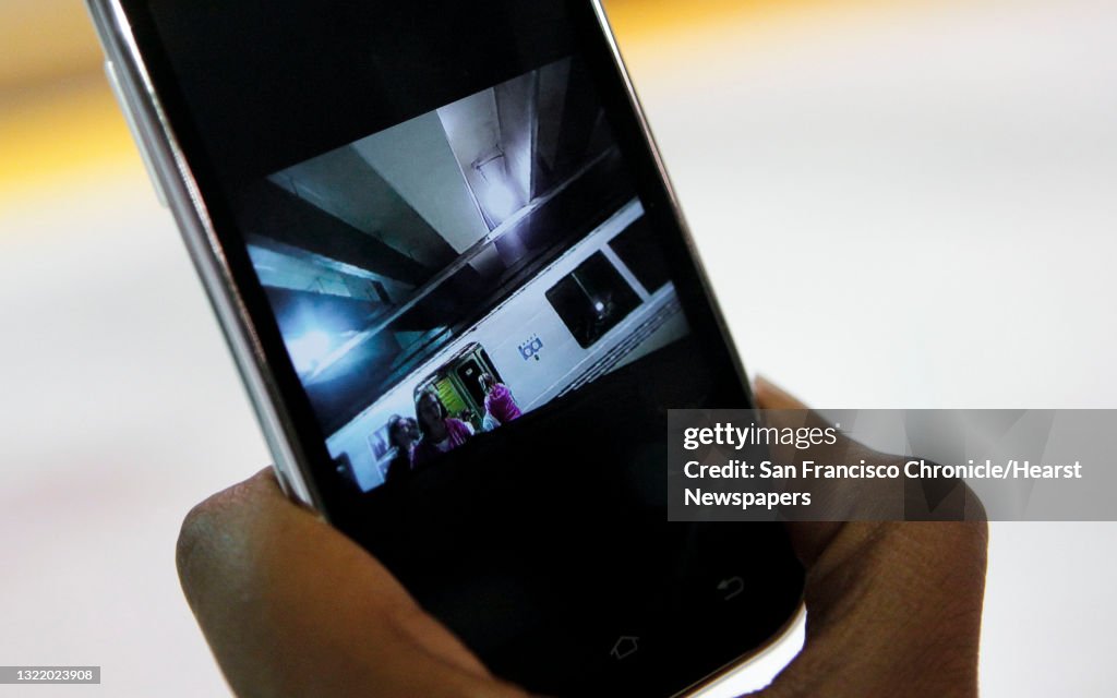 Sergeant Tanzanika Carter with the BART police force, shows how the Axon Taser Flex camera video can be accessed by a smart phone while on patrol in the Powell Street station in San Francisco, Ca., on Wednesday Nov. 20, 2013. San Francisco Police officers