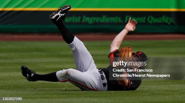 Outfielder Gary Brown, was able to make a sliding catch to rob Juan Perez, of a hit in the first inning during an inner squad game at Scottsdale...