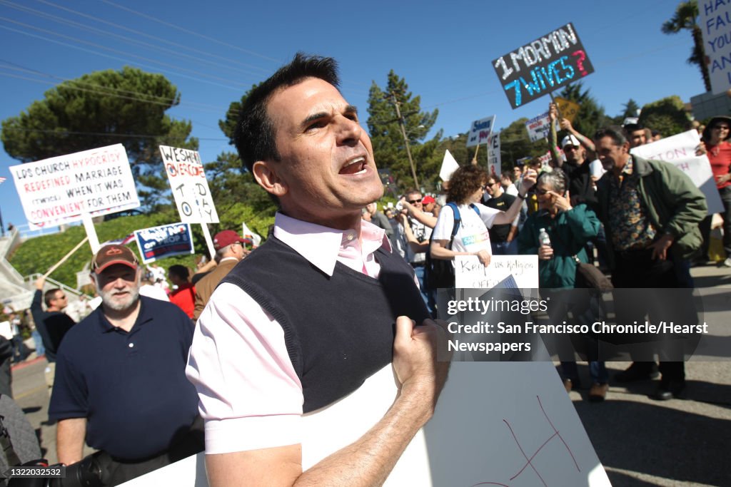 Scott Pettigrew of Berkeley shouts at a vehicle driving past the