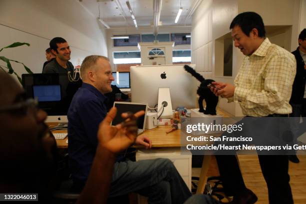 Color co-founders Bill Nguyen and Vincent Mallet talk with co-workers on Thursday, March 10, 2011 in Palo Alto, Calif. At Color's office. Color is...