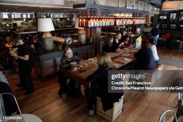 Eileen Kornblum of Menlo Park and Rebecca Friend of Palo Alto enjoy the Calafia Cafe along with other diners in Palo Alto, Calif. On Monday May 24,...