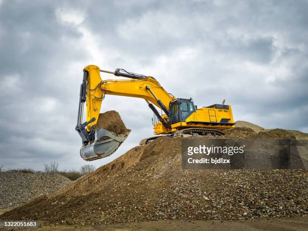 excavator blue sky heavy machine construction site - archaeology stock pictures, royalty-free photos & images
