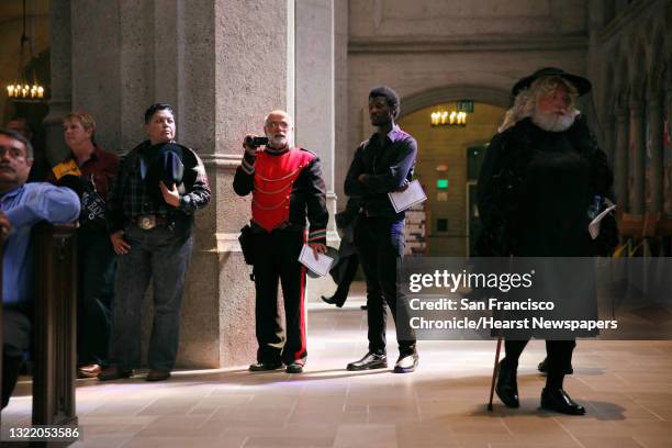 Gary Sponholtz of the San Francisco Lesbian/Gay Freedom Band video tapes during the funeral for Jose Julio Sarria while wearing a uniform for the...