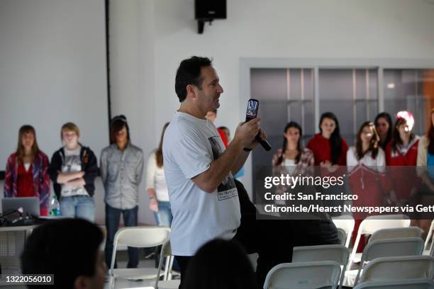 Jeff Steinberg, Sojourn to the Past founder, holds a microphone to his cell phone as he makes a call to Elizabeth Eckford, one of the Little Rock...