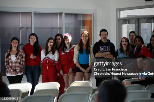 Students call out, "Hi Elizabeth," while Jeff Steinberg , Sojourn to the Past founder, holds a microphone to his cell phone as he makes a call to...