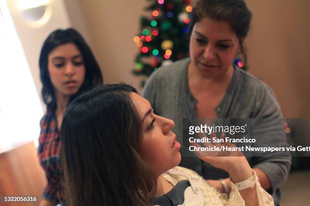 Katy Sharify , who received stem cell therapy before the study she was part of was cancelled, talks with her mother Zohreh Sharify and sister, Julie...