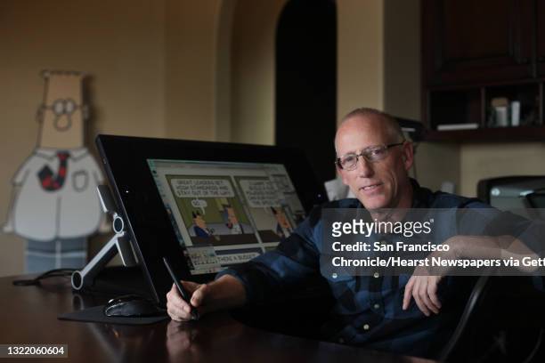 Scott Adams, cartoonist and author and creator of "Dilbert", poses for a portrait in his home office on Monday, January 6, 2014 in Pleasanton, Calif....