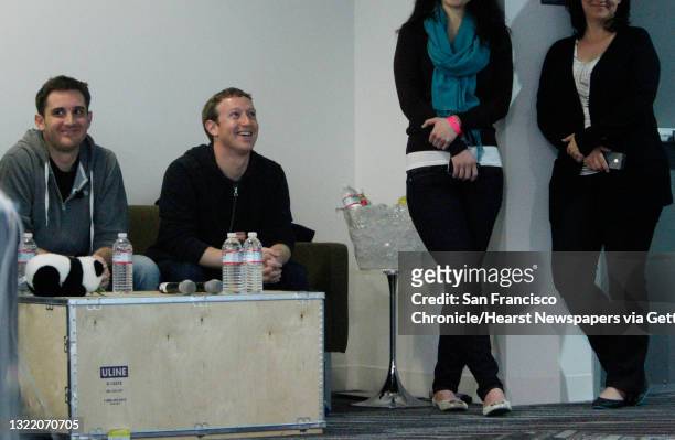 Mark Zuckerberg sits with Chris Struhar , tech lead as they listen to Julie Zhuo , director of design speak during a press conference where a...