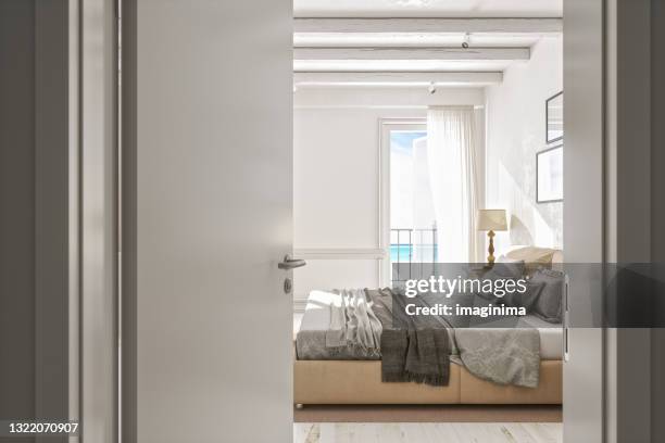 open door to classic scandinavian bedroom - beige bedroom stock pictures, royalty-free photos & images