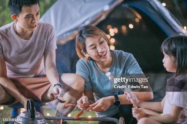 asian chinese family with daughter enjoying bbq grill camping at backyard of their house staycation weekend activities - chinese eating backyard stock pictures, royalty-free photos & images