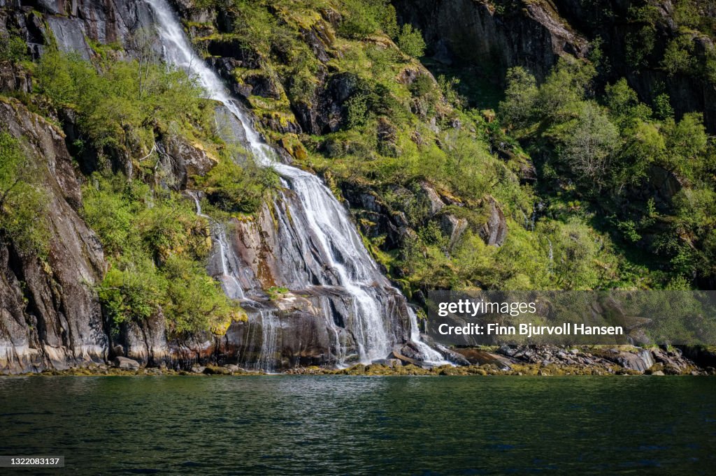 Waterfall in Trollfjord Lofoten Islands Norway-portrait