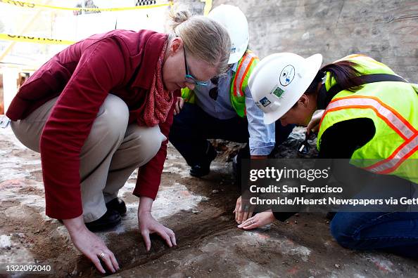 Rebecca Karberg (l to r), U.S. General Services Administration historic preservation specialist and Edward Yarbrough, ICF International senior architectural historian and Joanne Grant, ICF International  archaeologist, look closer at a separation in the a