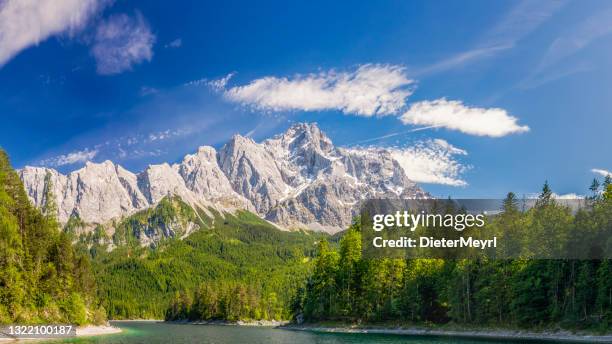 zugspitze mountain and eibsee lake - zugspitze mountain stock pictures, royalty-free photos & images