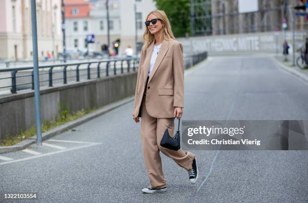 Cheyenne Tulsa is seen wearing beige suit Zara, Prada bag, Converse shoes, Persol sunglasses on June 05, 2021 in Berlin, Germany.