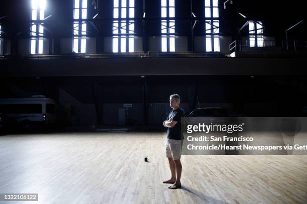 Peter Acworth, owner of the Armory and Kink.com, poses for a portrait in the Drill Court at the Armory on Monday, October 12, 2015 in San Francisco,...