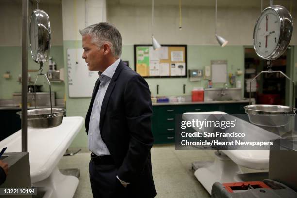 San Francisco Chief Medical Examiner Michael Hunter stands in the..., News Photo