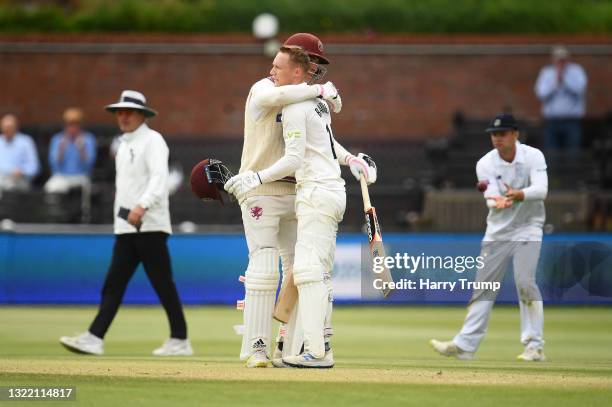 George Bartlett of Somerset celebrates after reaching their century with team mate Tom Banton during Day Four of the LV= Insurance County...