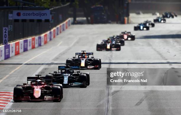 Charles Leclerc of Monaco driving the Scuderia Ferrari SF21 leads the field at the start of the race during the F1 Grand Prix of Azerbaijan at Baku...