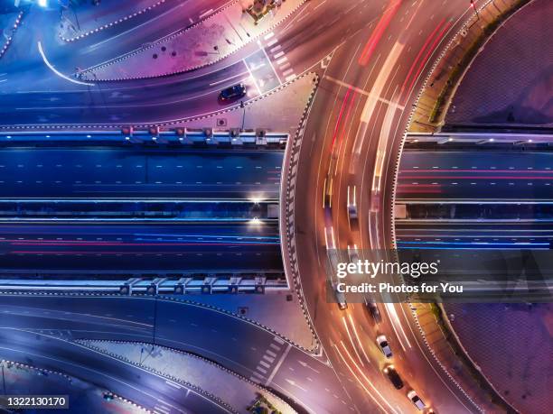 aerial view/circular road traffic at night - fast abstract stock pictures, royalty-free photos & images