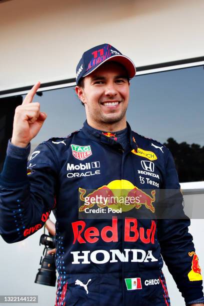 Race winner Sergio Perez of Mexico and Red Bull Racing celebrates in parc ferme during the F1 Grand Prix of Azerbaijan at Baku City Circuit on June...