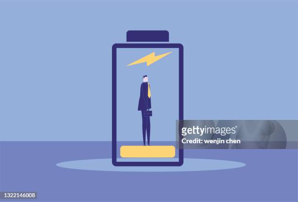 the business man is standing in the battery to charge himself - abzeichen stock illustrations