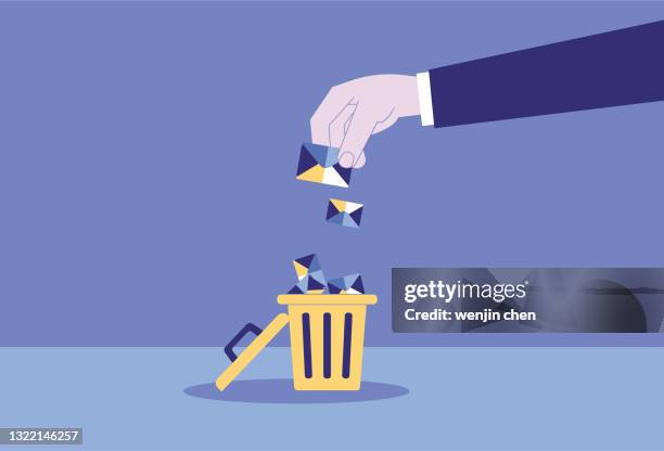 the letter was thrown into the trash can, and the spam was deleted - e mail spam stock illustrations
