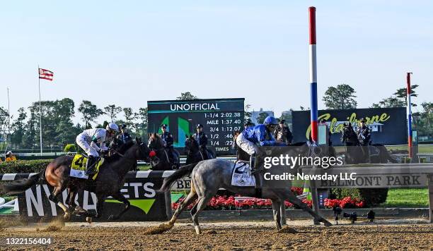 Jockey Luis Saez riding Essential Quality crosses the finish line to win the 153rd Belmont Stakes at Belmont Park in Elmont, New York on June 5,...