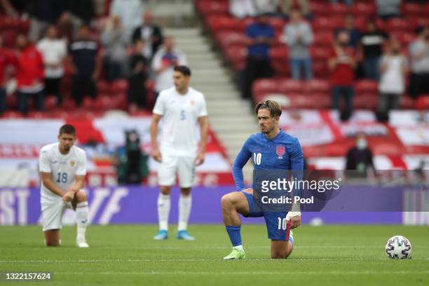 Jack Grealish of England takes a knee in support of the Black Lives Matter movement prior to the international friendly match between England and...
