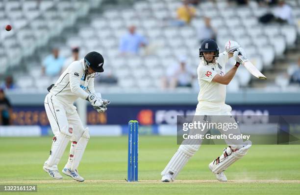 Joe Root of England hits runs watched on by BJ Watling of New Zealand during Day 5 of the First LV= Insurance Test Match between England and New...