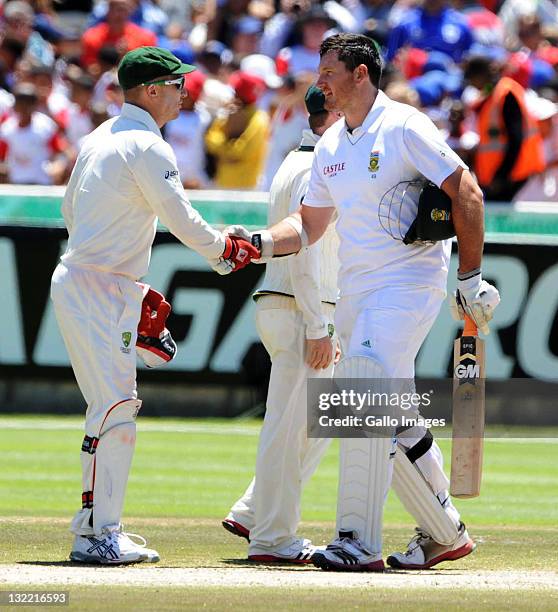 Graeme Smith of South Africa shakes hands with Brad Haddin of Australia during day three of the 1st Test match between South Africa and Australia at...