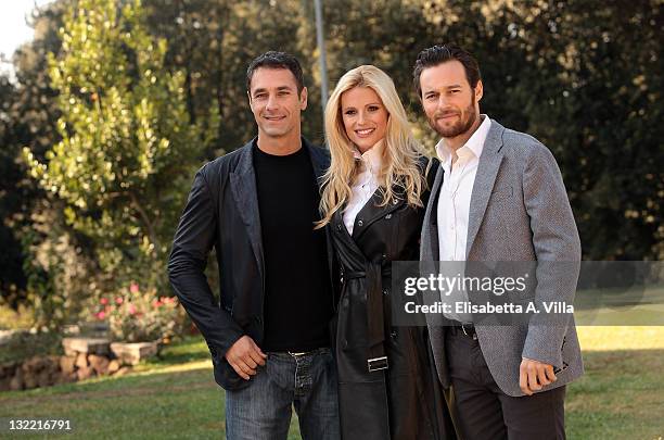 Director Raoul Bova, actress Michelle Hunziker and actor Giorgio Marchesi attend 'Amore Nero' photocall at Villa Borghese on November 11, 2011 in...