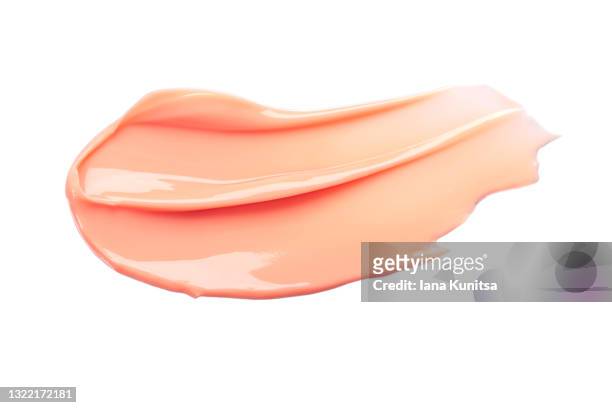 beautiful delicate pink smear of bb face cream on white background isolated. tonal foundation is smudged. products for makeup and skin care. organic cosmetics. cosmetology. closeup. moisturizing cream - smudged stock pictures, royalty-free photos & images
