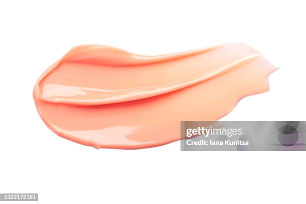 beautiful delicate pink smear of bb face cream on white background isolated. tonal foundation is smudged. products for makeup and skin care. organic cosmetics. cosmetology. closeup. moisturizing cream - face mask beauty product - fotografias e filmes do acervo