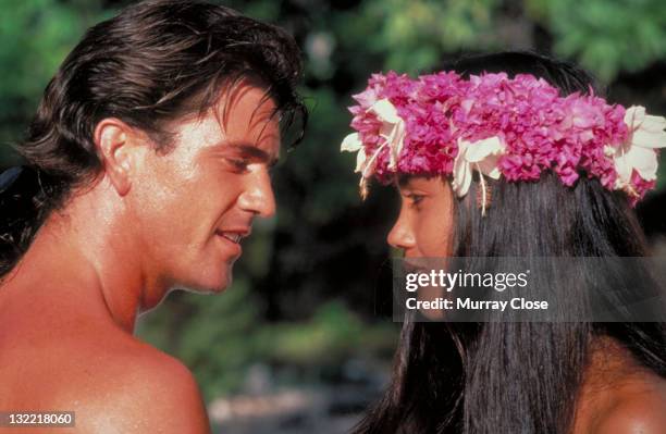 Actor Mel Gibson as mutineer Fletcher Christian and Tevaite Vernette as Mauatua in the film 'The Bounty', 1984.